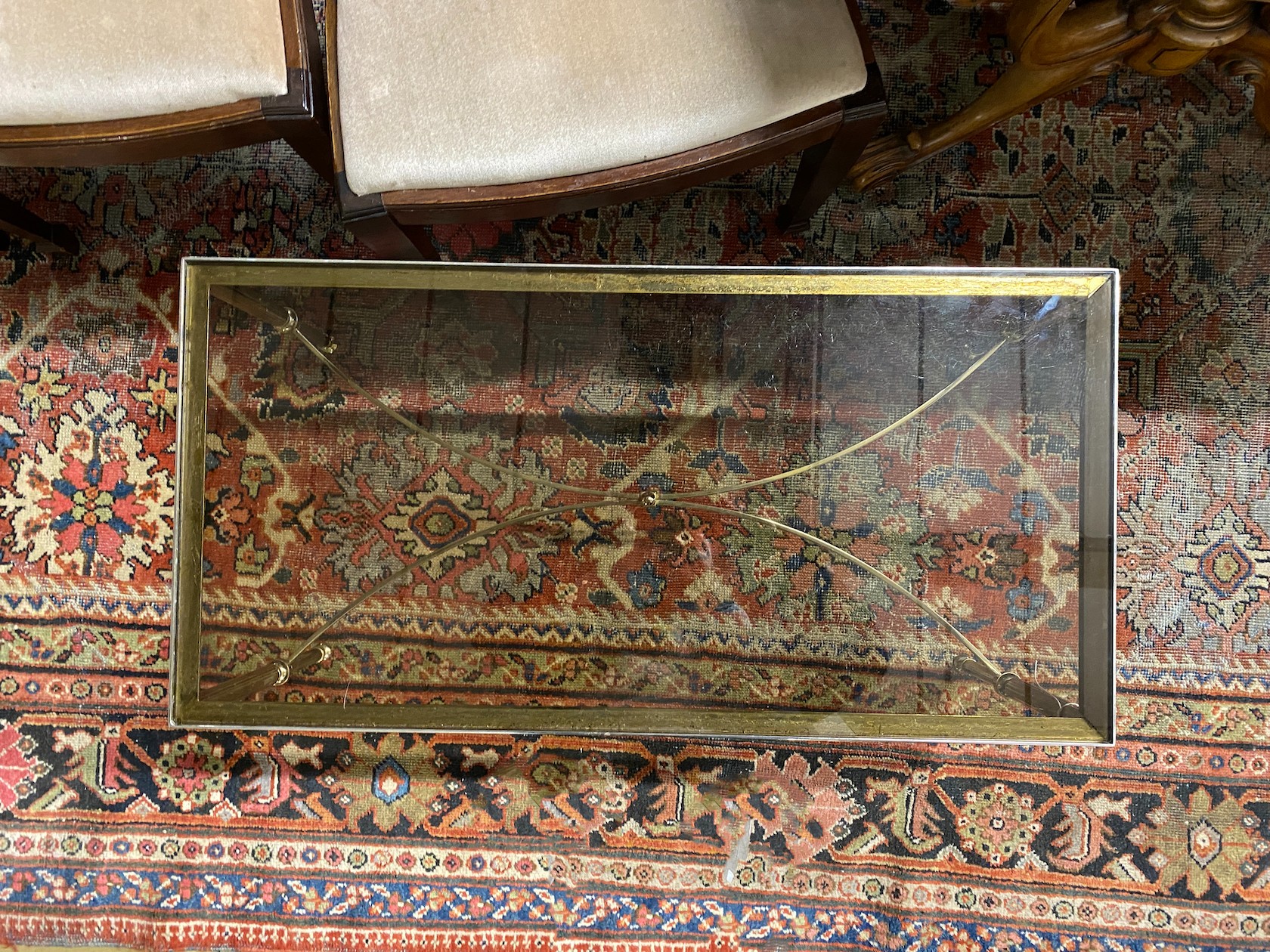 A rectangular gilt metal and smoked glass coffee table, width 91cm, depth 46cm, height 41cm
